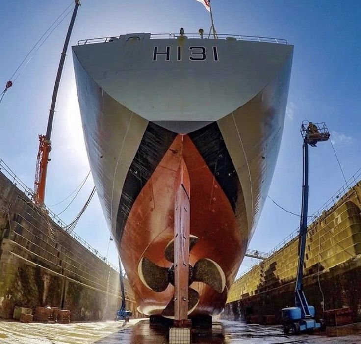 Ship hull in a dry dock during shipyard maintenance work in Kochi